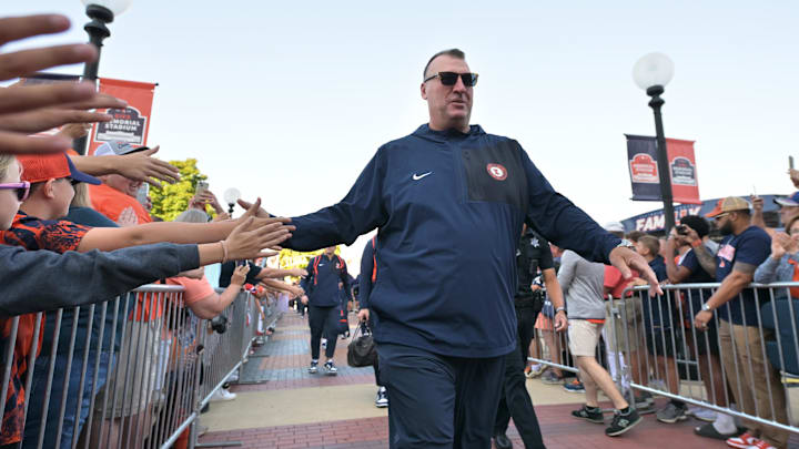 Sep 27, 2025; Champaign, Illinois, USA;  Illinois Fighting Illini head coach Bret Bielema leads his team down the Illini Walk before an NCAA football game with the Southern California Trojans at Memorial Stadium. Mandatory Credit: Ron Johnson-Imagn Images