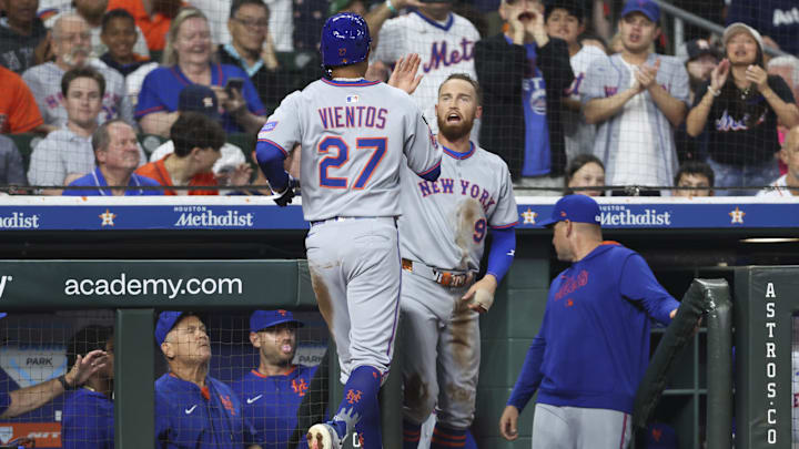 Mar 28, 2025; Houston, TX, USA; New York Mets left fielder Brandon Nimmo (9) celebrates with third baseman Mark Vientos (27) after Vientos scores a run during the second inning against the Houston Astros at Daikin Park. Mandatory Credit: Troy Taormina-Imagn Images