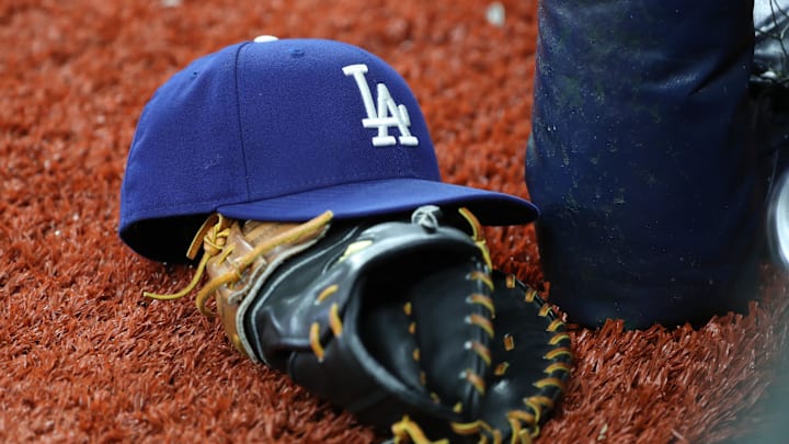 May 21, 2019; St. Petersburg, FL, USA; A detail view of Los Angeles Dodgers hat and glove at Tropicana Field. Mandatory Credit: Kim Klement-Imagn Images
