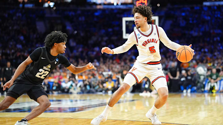 Virginia Cavaliers guard Sam Lewis and Wright State Raiders guard TJ Burch Virginia Cavaliers guard Sam Lewis and Wright State Raiders guard TJ Burch