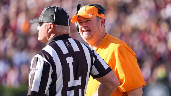 Oct 24, 2026; Columbia, South Carolina, USA;  Tennessee Volunteers head coach Josh Heupel talks with the line judge during the first half against the South Carolina Gamecocks at Williams-Brice Stadium.  Mandatory Credit: Jim Dedmon-Imagn Images