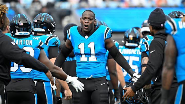 Oct 26, 2025; Charlotte, North Carolina, USA; Carolina Panthers linebacker Nic Scourton (11) runs on to the field before the game at Bank of America Stadium. Mandatory Credit: Bob Donnan-Imagn Images