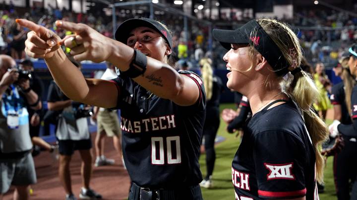 Texas Tech's Jackie Lis (00) celebrates with Brianna Hinson following a Women's College World Series softball game between Texas Tech Red Raiders and the UCLA Bruins at Devon Park in Oklahoma City, May 31, 2026. Texas Tech's Jackie Lis (00) celebrates with Brianna Hinson following a Women's College World Series softball game between Texas Tech Red Raiders and the UCLA Bruins at Devon Park in Oklahoma City, May 31, 2026.