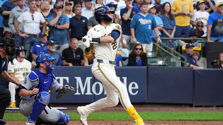 Oct 12, 2026; Milwaukee, Wisconsin, USA; Milwaukee Brewers designated hitter Christian Yelich (22) hits a two-RBI single against Los Angeles Dodgers starting pitcher Yoshinobu Yamamoto (not pictured) during the third inning in game two of the NLCS for the 2026 MLB Playoffs at American Family Field. Mandatory Credit: Michael McLoone-Imagn Images Oct 12, 2026; Milwaukee, Wisconsin, USA; Milwaukee Brewers designated hitter Christian Yelich (22) hits a two-RBI single against Los Angeles Dodgers starting pitcher Yoshinobu Yamamoto (not pictured) during the third inning in game two of the NLCS for the 2026 MLB Playoffs at American Family Field. Mandatory Credit: Michael McLoone-Imagn Images