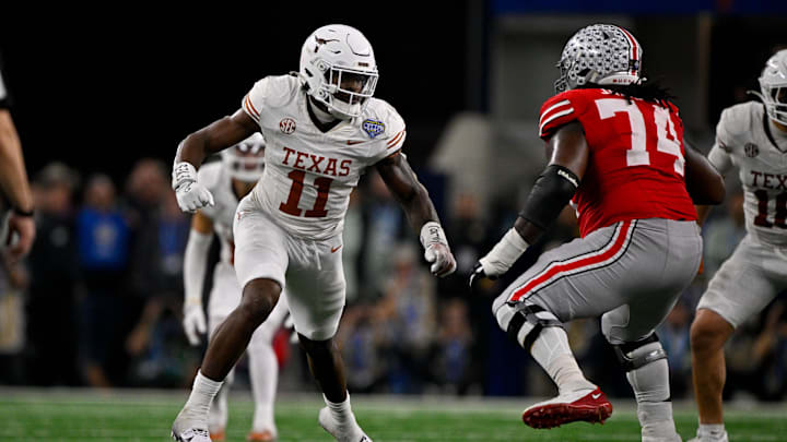 Jan 10, 2025; Arlington, TX, USA; Texas Longhorns linebacker Colin Simmons (11) and Ohio State Buckeyes offensive lineman Donovan Jackson (74) in action during the game between the Texas Longhorns and the Ohio State Buckeyes at AT&T Stadium. Mandatory Credit: Jerome Miron-Imagn Images