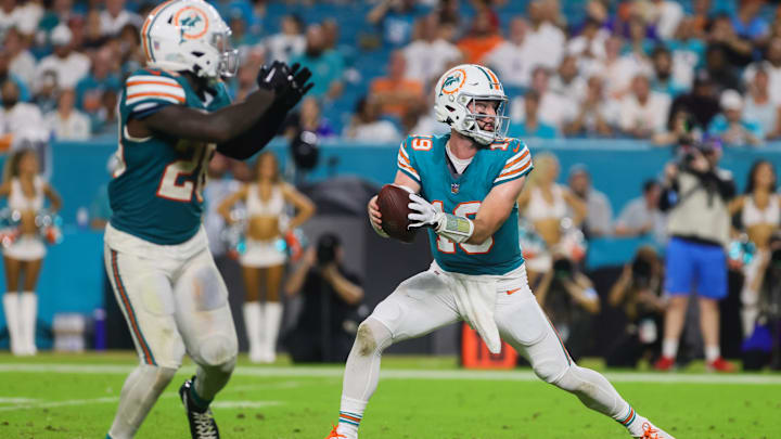 Miami Dolphins quarterback Skylar Thompson (19) fakes a handoff to running back De'Von Achane (28) during the fourth quarter at Hard Rock Stadium. Miami Dolphins quarterback Skylar Thompson (19) fakes a handoff to running back De'Von Achane (28) during the fourth quarter at Hard Rock Stadium.