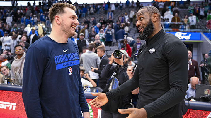 Dec 25, 2022; Dallas, Texas, USA; Dallas Mavericks guard Luka Doncic (left) talks with Los Angeles