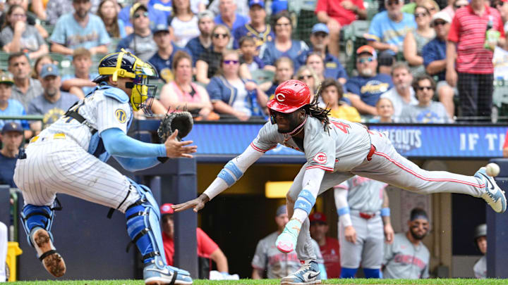 Jun 16, 2024; Milwaukee, Wisconsin, USA; Cincinnati Reds shortstop Elly De La Cruz (44) scores after an error as Milwaukee Brewers catcher William Contreras (24) waits for the ball in the third inning at American Family Field. Mandatory Credit: Benny Sieu-USA TODAY Sports