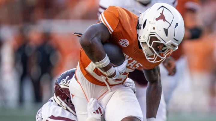 Texas Longhorns running back Quintrevion Wisner (26) carries the ball forward as the Texas Longhorns take on Mississippi State at Darrell K Royal-Texas Memorial Stadium in Austin Saturday, Sept. 28, 2024.