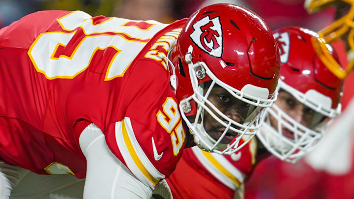 Dec 8, 2024; Kansas City, Missouri, USA; Kansas City Chiefs defensive tackle Chris Jones (95) and defensive end George Karlaftis (56) get ready before the snap during the first half against the Los Angeles Chargers at GEHA Field at Arrowhead Stadium. Mandatory Credit: Jay Biggerstaff-Imagn Images