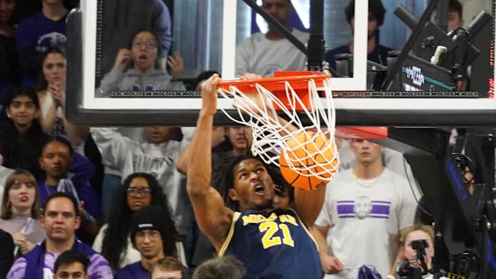 Feb 11, 2026; Evanston, Illinois, USA; Michigan Wolverines forward Morez Johnson Jr. (21) dunks the ball against the Northwestern Wildcats during the second half at Welsh-Ryan Arena. Mandatory Credit: David Banks-Imagn Images