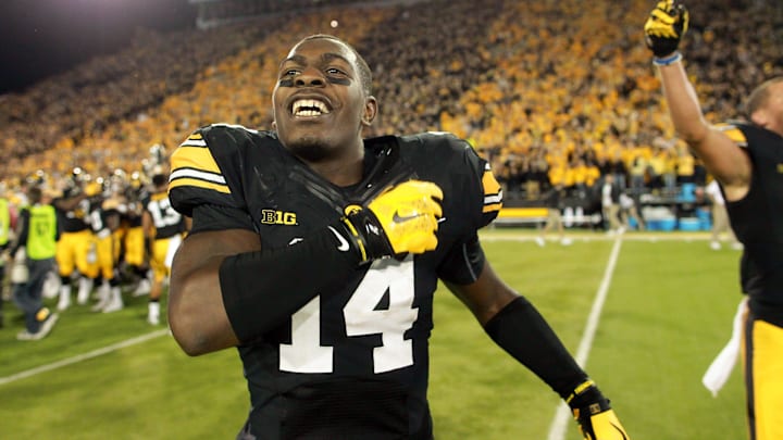 Iowa cornerback Desmond King (14) celebrates the Hawkeyes' 27-24 win over Pittsburgh at Kinnick Stadium Sept. 19, 2015.