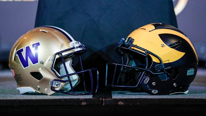 Michigan and Washington football helmets during a CFP national championship head coaches news conference at Liberty Hall in Houston on Sunday, Jan. 7, 2024.