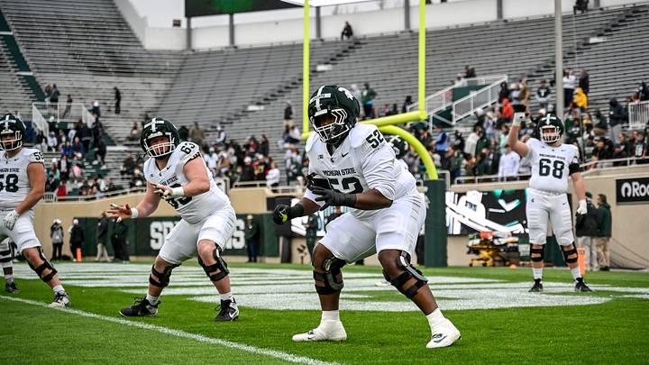 Michigan State's Nick Sharpe, center, runs a drill during the football Spring Showcase on Saturday, April 18, 2026, at Spartan Stadium in East Lansing. Michigan State's Nick Sharpe, center, runs a drill during the football Spring Showcase on Saturday, April 18, 2026, at Spartan Stadium in East Lansing.