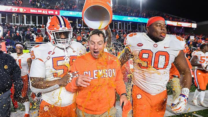 Clemson defensive lineman Christian Wilkins, back, douses head coach Dabo Swinney with Gatorade after the Tiger defeated Boston College 27-7 to win the Atlantic Division at Boston College's Alumni Stadium in Chestnut Hill, MA. Saturday, November 10, 2018. Also pictured are defensive linemen Jordan Williams, left, and Dexter Lawrence. Clemson defensive lineman Christian Wilkins, back, douses head coach Dabo Swinney with Gatorade after the Tiger defeated Boston College 27-7 to win the Atlantic Division at Boston College's Alumni Stadium in Chestnut Hill, MA. Saturday, November 10, 2018. Also pictured are defensive linemen Jordan Williams, left, and Dexter Lawrence.