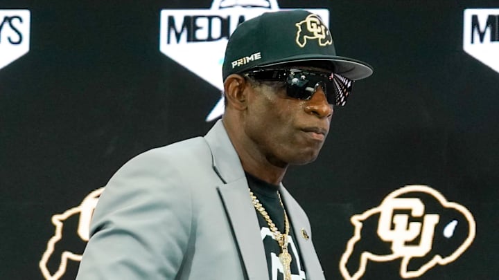 Jul 9, 2025; Frisco, TX, USA; Colorado head coach Deion Sanders walks onto the stage during 2025 Big 12 Football Media Days at The Star. Mandatory Credit: Raymond Carlin III-Imagn Images