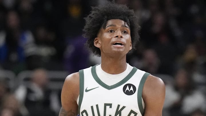 Oct 10, 2024; Milwaukee, Wisconsin, USA; Milwaukee Bucks guard AJ Johnson (77) brings the ball up the court against the Los Angeles Lakers in the second half at Fiserv Forum. Mandatory Credit: Michael McLoone-Imagn Images