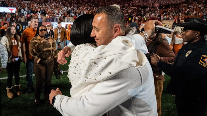 Texas Longhorns head coach Steve Sarkisian embraces his wife, Loreal, after beating Clemson in the first round of the College Football Playoffs. Texas Longhorns head coach Steve Sarkisian embraces his wife, Loreal, after beating Clemson in the first round of the College Football Playoffs.