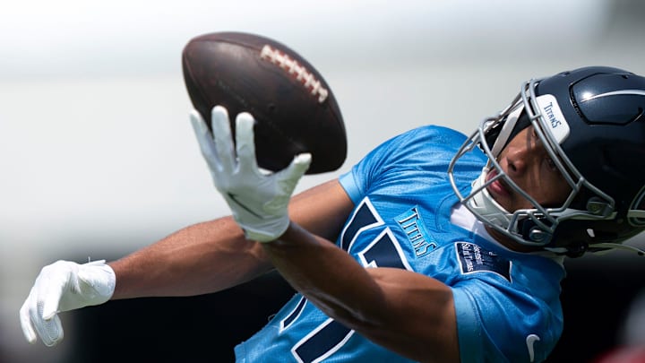 Tennessee Titans wide receiver Chimere Dike (17) makes a one-hand grab during drills during mandatory Titans Minicamp at Ascension Saint Thomas Sports Park in Nashville, Tenn., Tuesday, June 10, 2025.