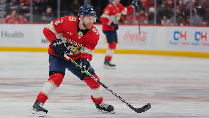 Mar 3, 2025; Sunrise, Florida, USA; Florida Panthers center Sam Bennett (9) moves the puck against the Tampa Bay Lightning during the second period at Amerant Bank Arena. Mandatory Credit: Sam Navarro-Imagn Images