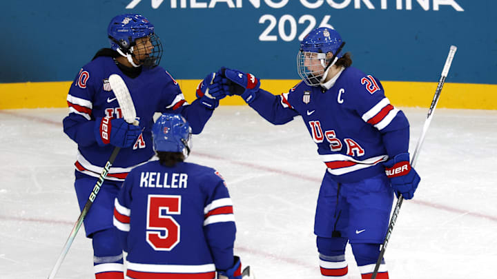 Feb 7, 2026; Milan, Italy; Hilary Knight (21) of the United States celebrates with Laila Edwards (10) of the United States after scoring a goal against Finland  in women's ice hockey group A play during the Milano Cortina 2026 Olympic Winter Games at Milano Rho Ice Hockey Arena. Mandatory Credit: David W Cerny/Reuters via Imagn Images