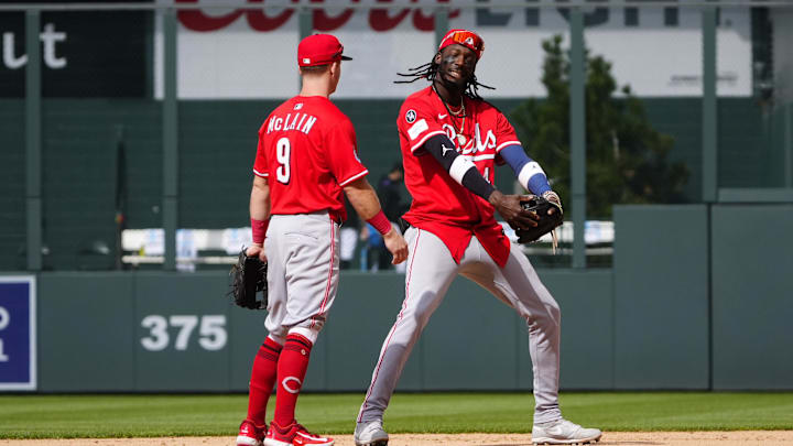 Apr 26, 2025; Denver, Colorado, USA; Cincinnati Reds second baseman Matt McLain (9) and shortstop Elly De La Cruz (44) celebrate defeating the Colorado Rockies at Coors Field. Mandatory Credit: Ron Chenoy-Imagn Images