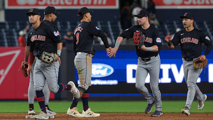 Aug 20, 2024; Bronx, New York, USA; Cleveland Guardians second baseman Andres Gimenez (0) celebrates with teammates after defeating the New York Yankees in twelve innings at Yankee Stadium. Mandatory Credit: Vincent Carchietta-Imagn Images