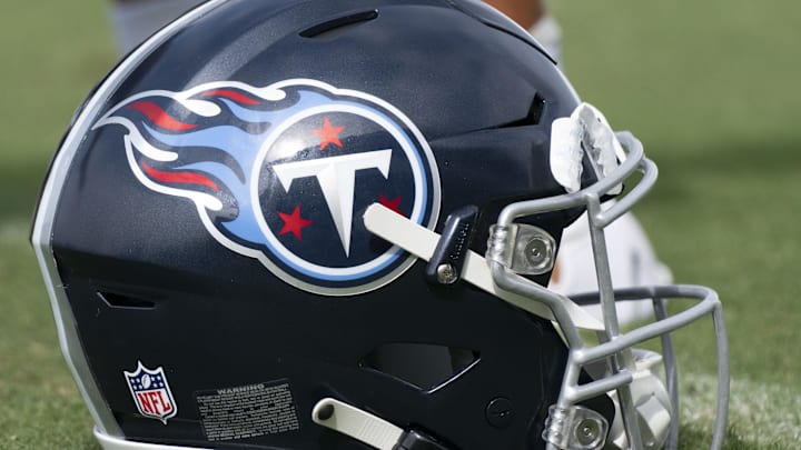 Jul 30, 2022; Nashville, Tennessee, USA;  A Tennessee Titans helmet rests on the field during a training camp practice at Ascension Saint Thomas Sports Park. Mandatory Credit: George Walker IV-Imagn Images