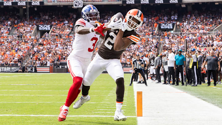Sep 22, 2024; Cleveland, Ohio, USA; Cleveland Browns wide receiver Amari Cooper (2) makes a touchdown reception under coverage by New York Giants cornerback Deonte Banks (3) during the first quarter at Huntington Bank Field.  