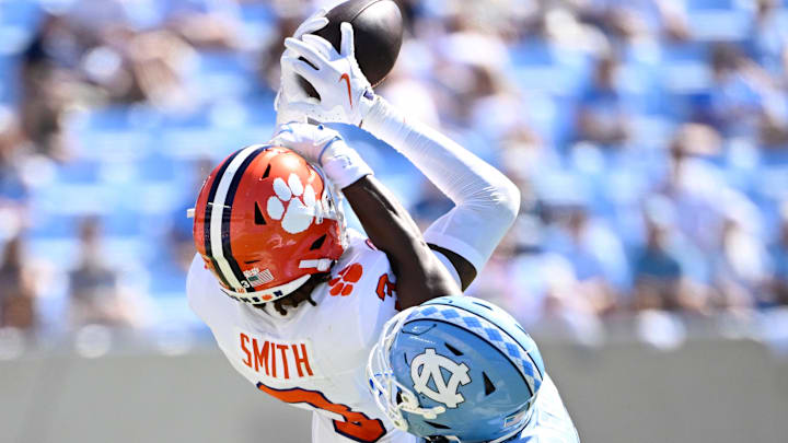Oct 4, 2025; Chapel Hill, North Carolina, USA; Clemson Tigers wide receiver Tristan Smith (3) catches a passs as North Carolina Tar Heels defensive back Jaiden Patterson (18) defends in the second quarter at Kenan Stadium. Mandatory Credit: Bob Donnan-Imagn Images