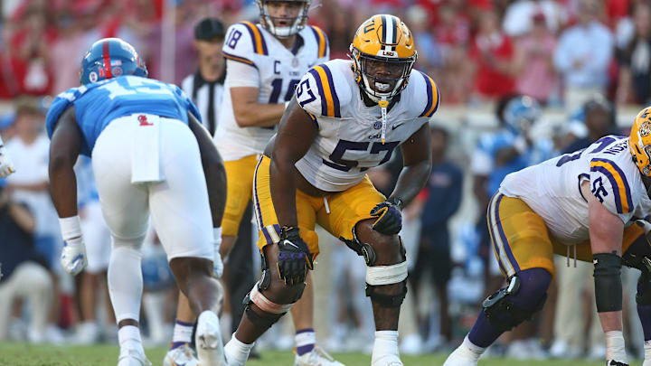 Sep 27, 2025; Oxford, Mississippi, USA; LSU Tigers offensive lineman Carius Curne (57) waits for the snap during the fourth quarter against the Mississippi Rebels at Vaught-Hemingway Stadium. Mandatory Credit: Petre Thomas-Imagn Images Sep 27, 2025; Oxford, Mississippi, USA; LSU Tigers offensive lineman Carius Curne (57) waits for the snap during the fourth quarter against the Mississippi Rebels at Vaught-Hemingway Stadium. Mandatory Credit: Petre Thomas-Imagn Images