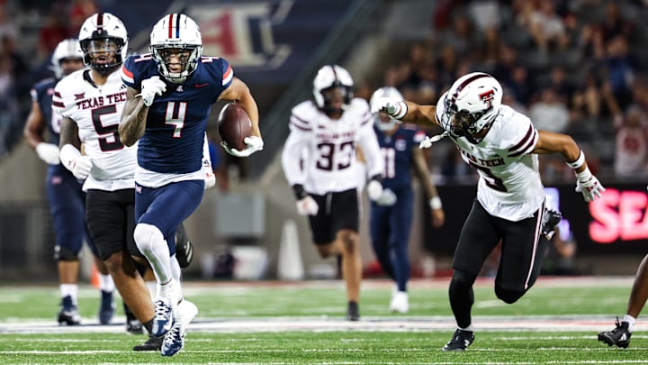 Oct 5, 2024; Tucson, Arizona, USA;  Arizona Wildcats wide receiver Tetairoa McMillan (4) runs with the ball during third quarter against Texas Tech Red Raiders at Arizona Stadium. 