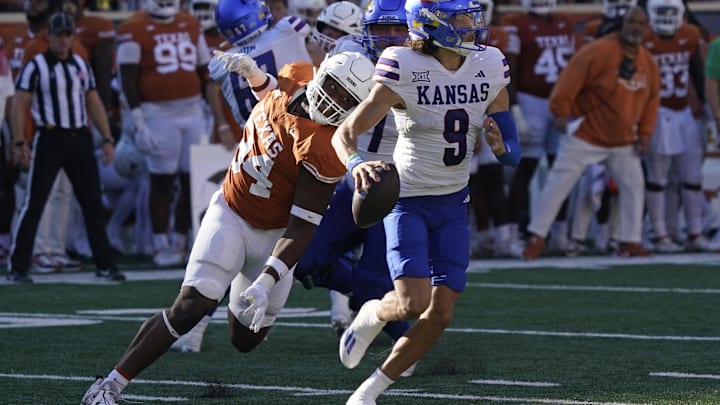 Texas defensive lineman Jaray Bledsoe chases Kansas quarterback Jason Bean in 2023. 