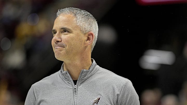 Mar 9, 2024; Tallahassee, Florida, USA; Florida State Seminoles head football coach Mike Norvell accepts the Bear Bryant coach of the Year award during a media timeout of a basketball game against the Miami Hurricanes at Donald L. Tucker Center. Mandatory Credit: Melina Myers-Imagn Images