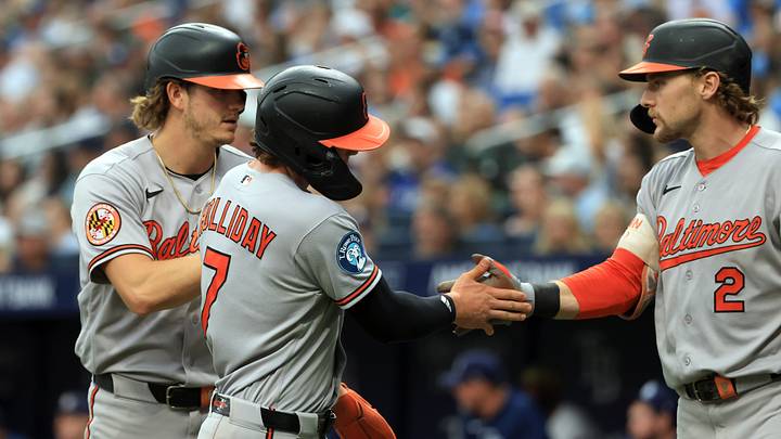 Aug 16, 2026; St. Petersburg, Florida, USA; Baltimore Orioles second baseman Jackson Holliday (7) and first baseman Coby Mayo (16) are congratulated by shortstop Gunnar Henderson (2) after they scored during the fifth inning against the Tampa Bay Rays at Tropicana Field. Mandatory Credit: Kim Klement Neitzel-Imagn Images Aug 16, 2026; St. Petersburg, Florida, USA; Baltimore Orioles second baseman Jackson Holliday (7) and first baseman Coby Mayo (16) are congratulated by shortstop Gunnar Henderson (2) after they scored during the fifth inning against the Tampa Bay Rays at Tropicana Field. Mandatory Credit: Kim Klement Neitzel-Imagn Images