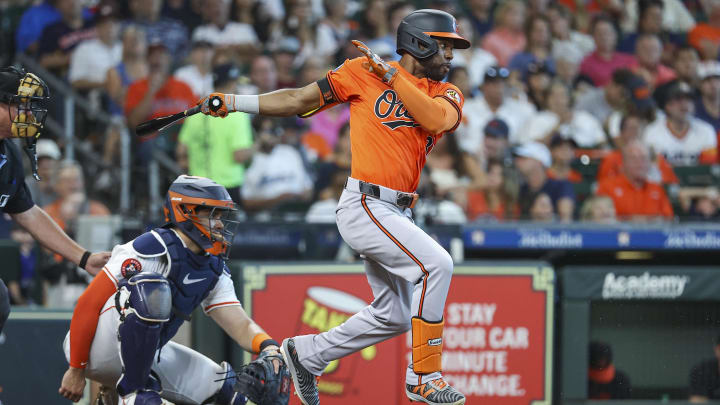 Jun 22, 2024; Houston, Texas, USA; Baltimore Orioles center fielder Cedric Mullins (31) hits an infield single during the fourth inning against the Houston Astros at Minute Maid Park. 