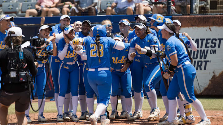 Jun 1, 2025; Oklahoma City, OK, USA;  UCLA Bruins players celebrate catcher Alexis Ramirez (28) home run in the second inning against the Tennessee Lady Volunteers during the NCAA Softball Women's College World Series at Devon Park. Mandatory Credit: Brett Rojo-Imagn Images