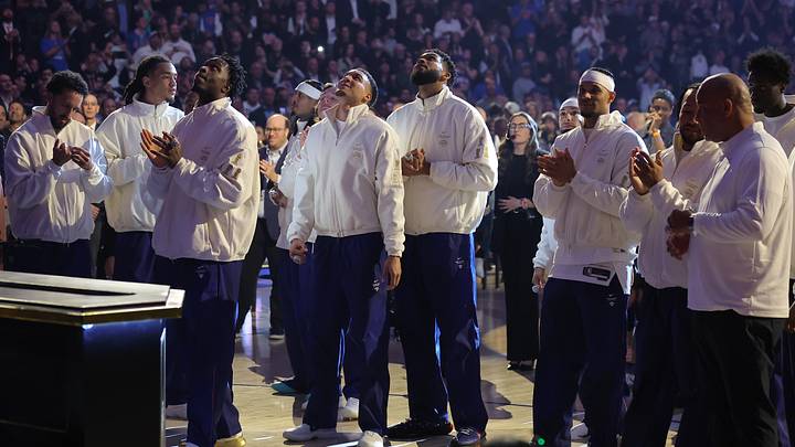 Oct 20, 2026; New York, New York, USA; New York Knicks players watch their 2025-26 championship banner ascend to the rafters during a ceremony before opening night game against the Philadelphia 76ers at Madison Square Garden. Mandatory Credit: Brad Penner-Imagn Images