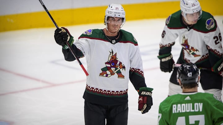 Dec 6, 2021; Dallas, Texas, USA; Arizona Coyotes left wing Loui Eriksson (21) waves to the crowd as he is recognized for playing in 1000 career NHL games during the first period against the Dallas Stars at the American Airlines Center. Mandatory Credit: Jerome Miron-Imagn Images