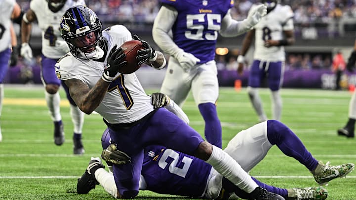 Nov 9, 2025; Minneapolis, Minnesota, USA; Baltimore Ravens wide receiver Rashod Bateman (7) is tackled by Minnesota Vikings cornerback Isaiah Rodgers (2) during the fourth quarter at U.S. Bank Stadium. Mandatory Credit: Jeffrey Becker-Imagn Images