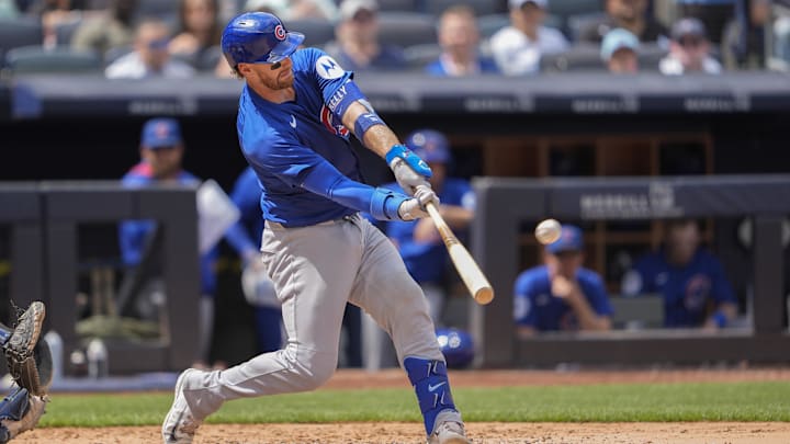 Jul 12, 2025; Bronx, New York, USA; Chicago Cubs catcher Carson Kelly (15) hits a home run against the New York Yankees during the eighth inning at Yankee Stadium. Jul 12, 2025; Bronx, New York, USA; Chicago Cubs catcher Carson Kelly (15) hits a home run against the New York Yankees during the eighth inning at Yankee Stadium.