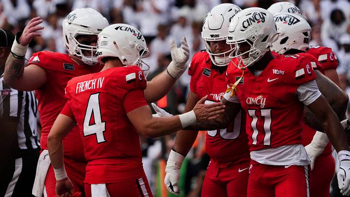 Sep 5, 2026; Cincinnati, Ohio, USA; Cincinnati Bearcats quarterback JC French IV (4) celebrates a touchdown with wide receiver Jv Gibson (11) against the Boston College Eagles in the first half at Nippert Stadium. Mandatory Credit: Aaron Doster-Imagn Images Sep 5, 2026; Cincinnati, Ohio, USA; Cincinnati Bearcats quarterback JC French IV (4) celebrates a touchdown with wide receiver Jv Gibson (11) against the Boston College Eagles in the first half at Nippert Stadium. Mandatory Credit: Aaron Doster-Imagn Images