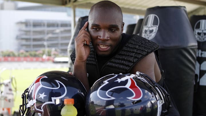 Houston Texans head coach DeMeco Ryans (59) talks on the phone during training camp at Methodist Training Center.