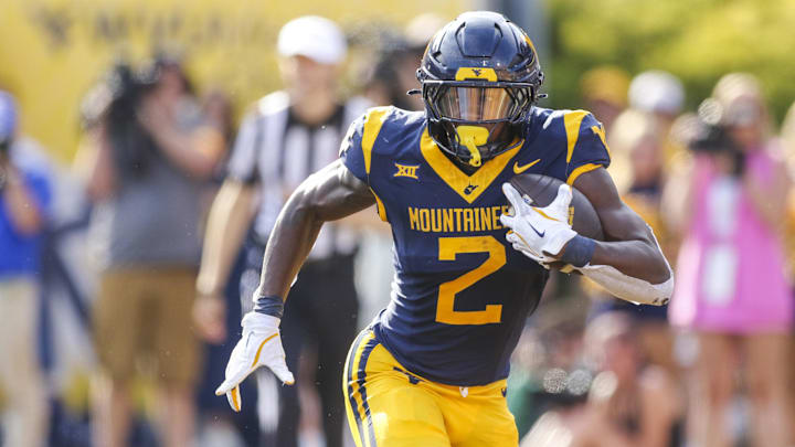 Sep 13, 2025; Morgantown, West Virginia, USA; West Virginia Mountaineers running back Tye Edwards (2) runs the ball during the second quarter against the Pittsburgh Panthers at Milan Puskar Stadium. Mandatory Credit: Ben Queen-Imagn Images