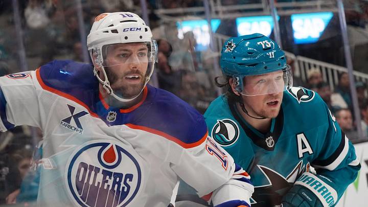 Apr 8, 2026; San Jose, California, USA;  Edmonton Oilers center Jason Dickinson (16) and San Jose Sharks center Tyler Toffoli (73) watch the puck in the second period at SAP Center at San Jose. Mandatory Credit: David Gonzales-Imagn Images