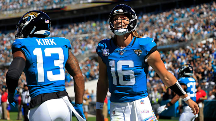 Jacksonville Jaguars quarterback Trevor Lawrence (16) celebrates his pass for a touchdown score to