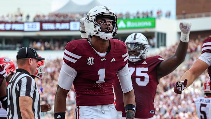 Mississippi State Bulldogs quarterback Kamario Taylor (1) reacts after a touchdown against the Georgia Bulldogs during the first half at Davis Wade Stadium at Scott Field. Mississippi State Bulldogs quarterback Kamario Taylor (1) reacts after a touchdown against the Georgia Bulldogs during the first half at Davis Wade Stadium at Scott Field.