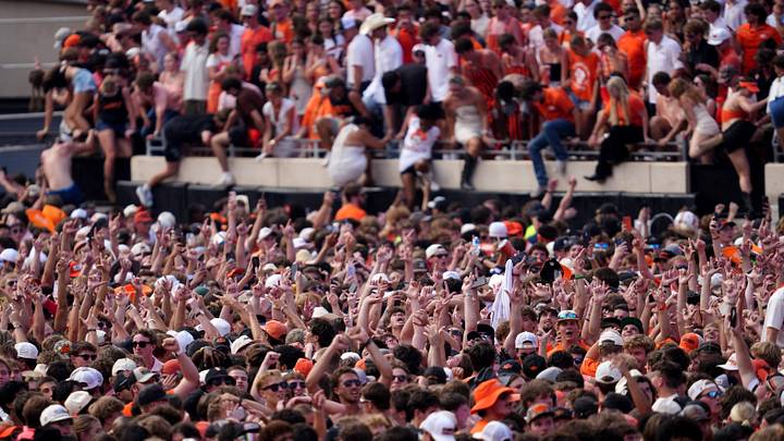 Fans storm the field following the college football game between the Oklahoma State Cowboys and the Oregon Ducks at Boone Pickens Stadium on Sept. 2, 2026. Fans storm the field following the college football game between the Oklahoma State Cowboys and the Oregon Ducks at Boone Pickens Stadium on Sept. 2, 2026.