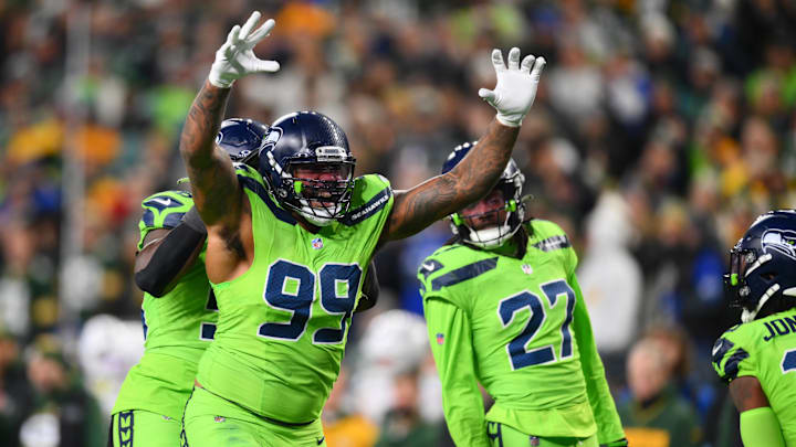 Dec 15, 2024; Seattle, Washington, USA; Seattle Seahawks defensive end Leonard Williams (99) celebrates after a defensive play against the Green Bay Packers during the second half at Lumen Field. Mandatory Credit: Steven Bisig-Imagn Images