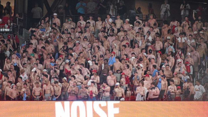 May 15, 2026; St. Louis, Missouri, USA; A group of shirtless fans cheer from their seats during the eleventh inning of a game between the St. Louis Cardinals and the Kansas City Royals at Busch Stadium. Mandatory Credit: Jeff Curry-Imagn Images